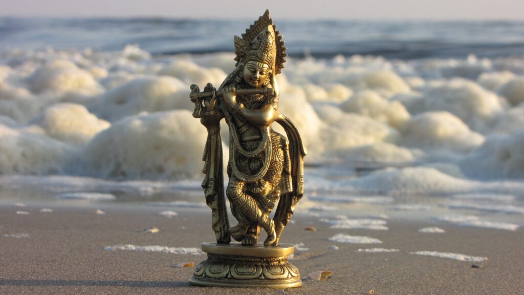 Ocean and statue flute playing