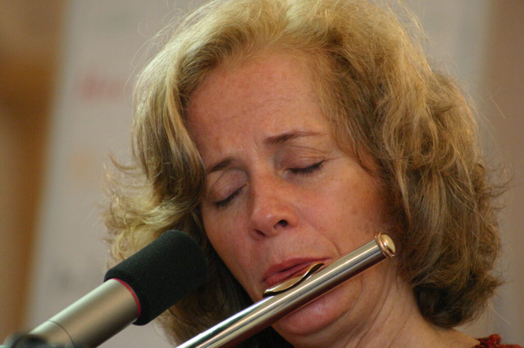 Nandin playing flute