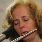 Nandin playing flute